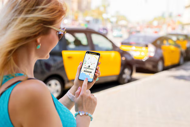 woman-using-ride-sharing-app-mobile-phone_746318-1322 (1)