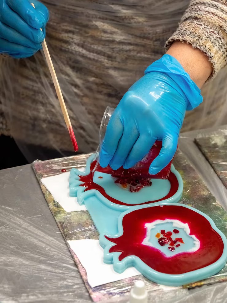 art-process-pouring-epoxy-resin-into-wooden-toy-technology-process-creating-painting-style-resin-art-works-with-epoxy-studio-makes-wooden-stand-with-imag