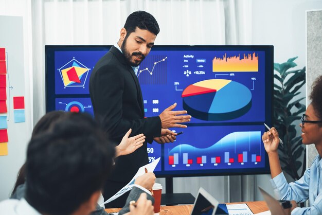 businessman-presenting-data-analysis-dashboard-display-tv-screen-modern-meeting-marketing-strategy-business-presentation-with-grou