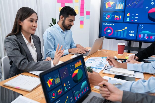 multiracial-analyst-team-use-bi-fintech-software-analyze-financial-data-meeting-table-financial-dashboard-data-display-laptop-scre