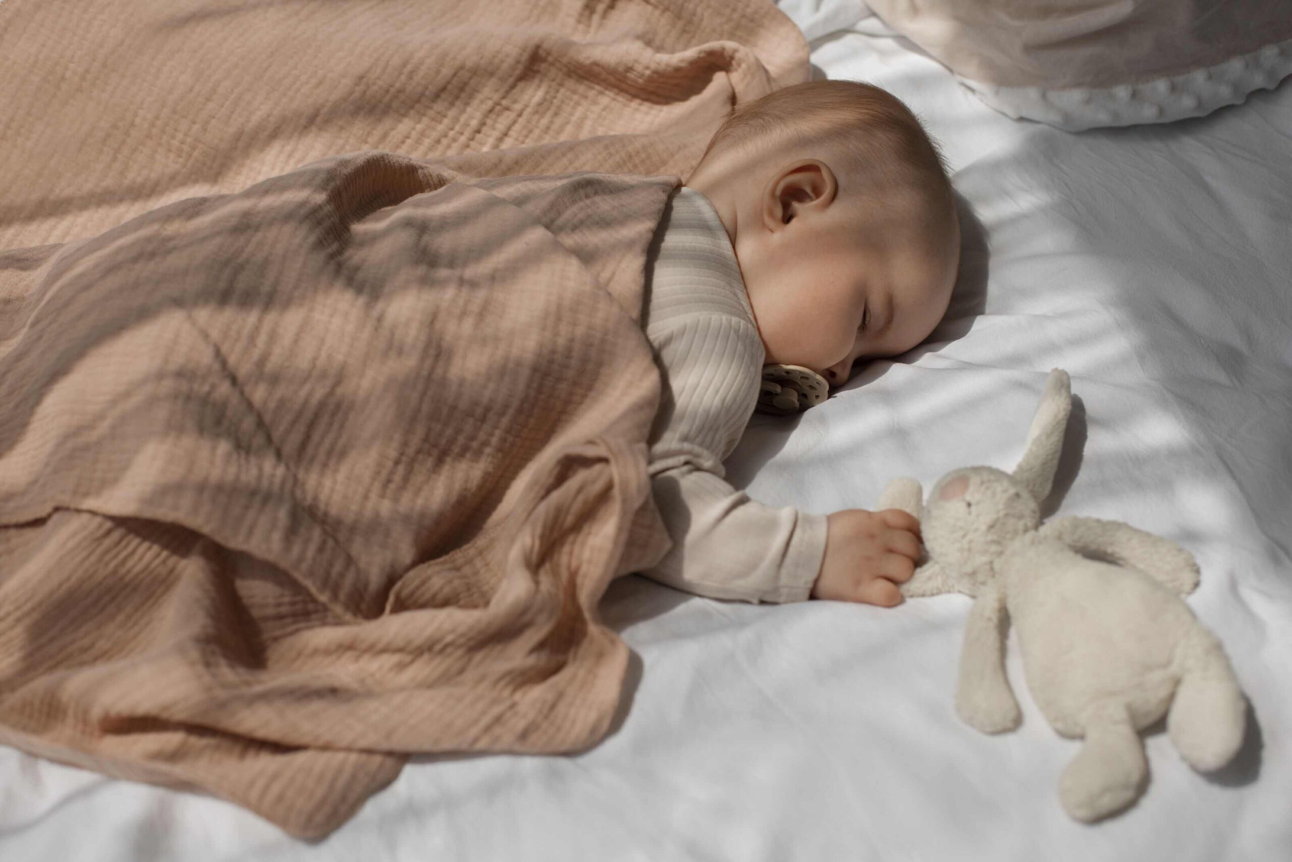 cute-baby-with-stuffed-animal_1_optimized_2000_11zon