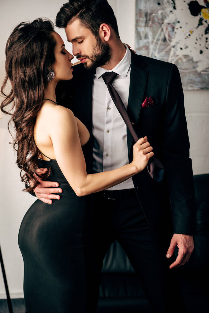 stylish woman in a black dress